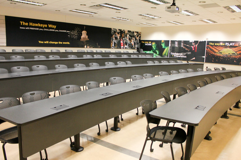 Image of classroom with tiered tables and chairs