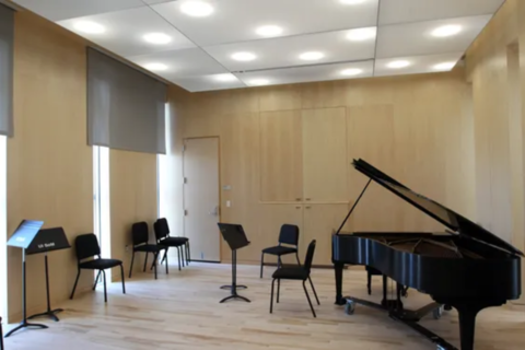 image of room with grand piano and music stands