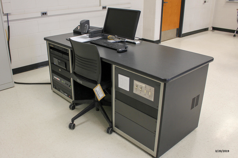 Photo of instructor station in classroom 219 Phillips Hall