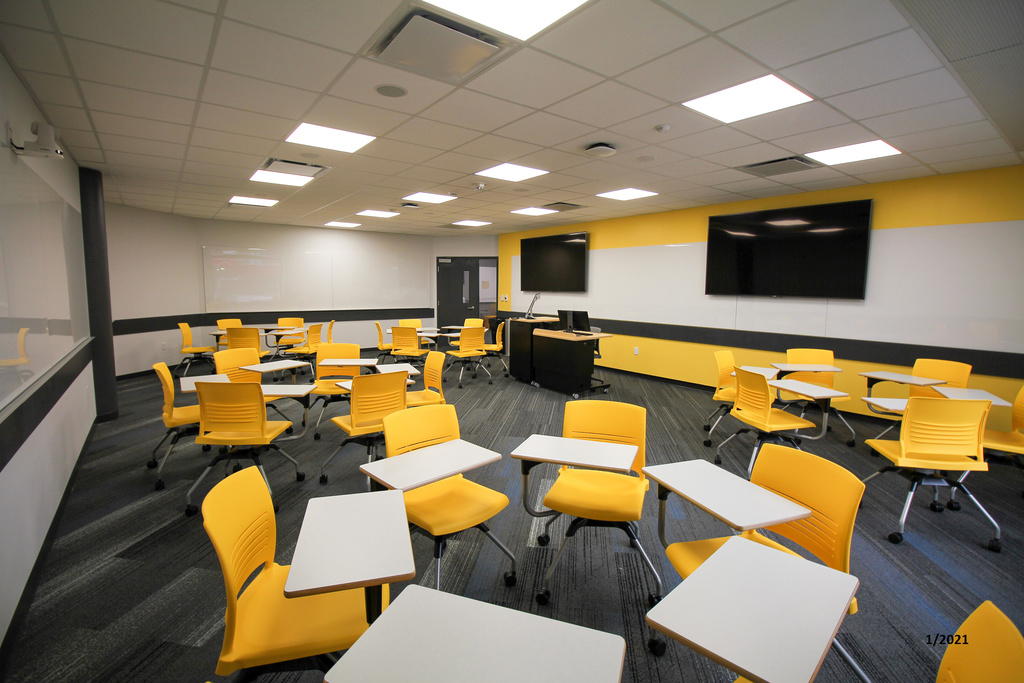 Image of classroom with tab arm chairs arranged in circles