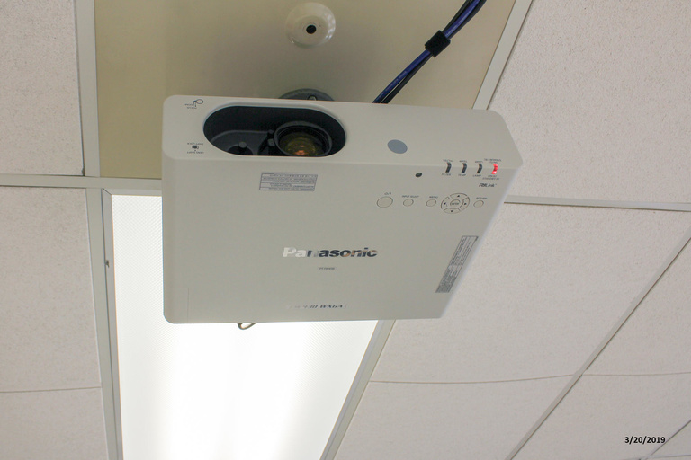 Photo of projector in classroom 219 Phillips Hall