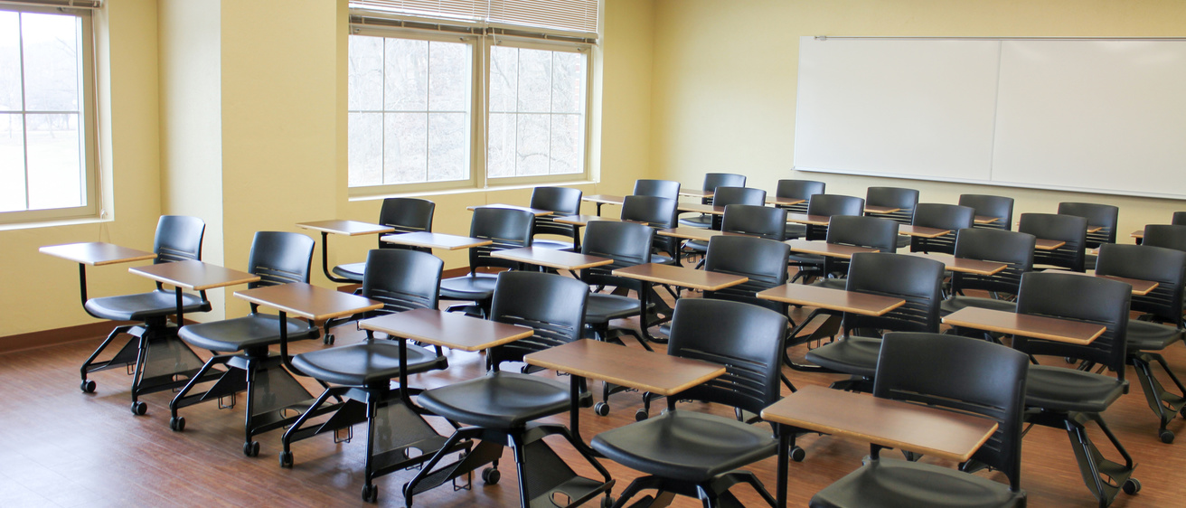Image of classroom filled with student desks