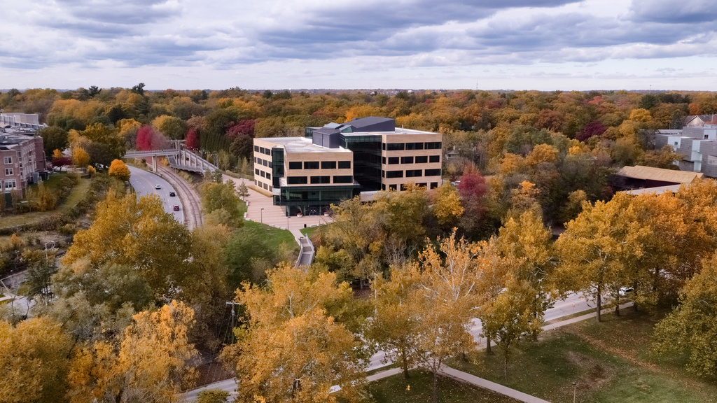 image of college of public health building surrounded by trees in autumn