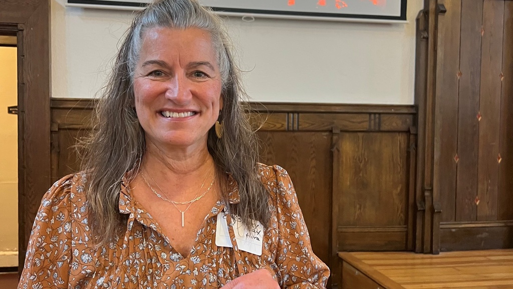 image of Mary Kay Hora holding 40 year longevity award